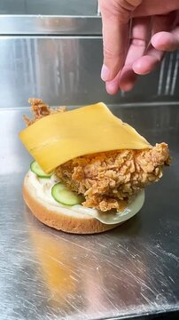 Adding Cheddar Cheese Slice on Zinger Burger