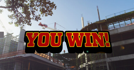 Image of you win text in red, with social media notifications over city construction site