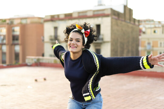 Portrait of happy young woman having fun in the city