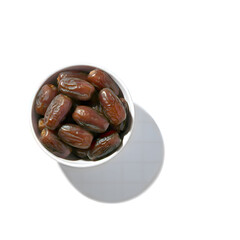 Realistic dates fruit served in a ceramic bowl