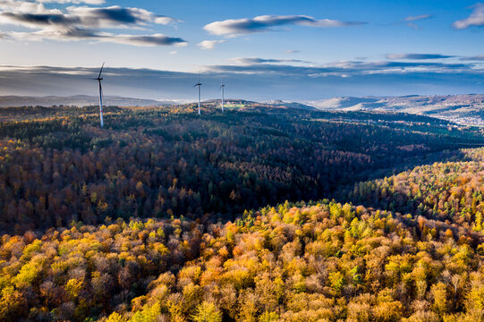 Germany, Baden Wurttemberg, Rems-Murr-Kreis, Aerial view of wind turbines and forest in Autumn