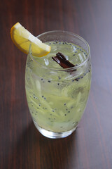 Refreshing iced cucumber lime drink with basil seeds and cinnamon