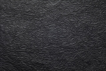 Wrinkled black paper texture background