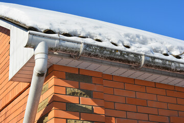 Rain Gutter Clogged with Snow and Ice