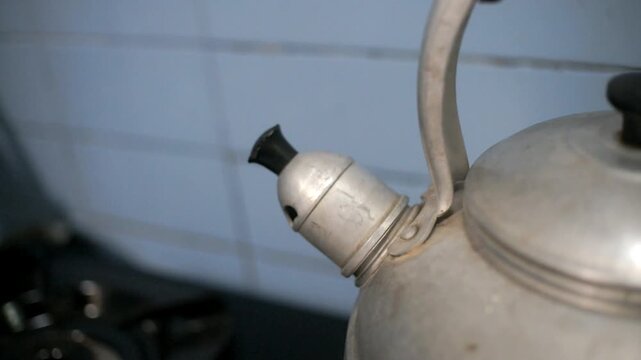 close up view from a kettle while boil the water 