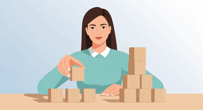 Woman building with wooden blocks on a table