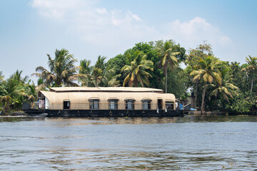 Obraz premium Alleppey backwaters in India, Alappuzha houseboats on waterway, small canal of Laccadive Sea, Tarshish land of Kerala, serene water body