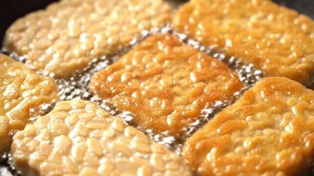Close-up of golden hash brown patties sizzling in hot oil.