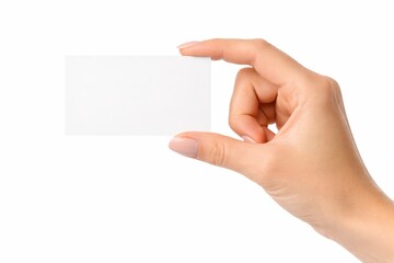 Obraz premium Female hand holding blank white business card between thumb and index minimal gesture with copy space high key studio isolated on white