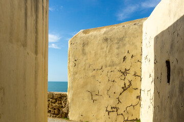 Historic Defensive Wall and Textured Masonry of Castillo de Santa Catalina in Cadiz Spain overlooking the Atlantic Ocean © photoopus