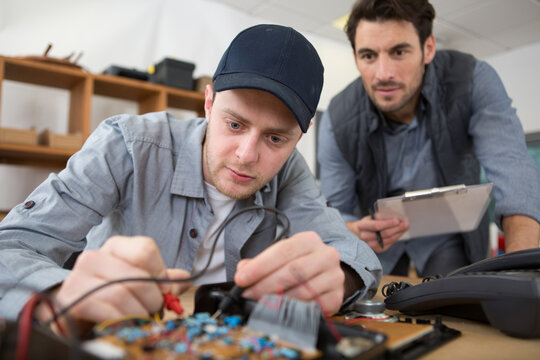 electronics student being assessed doing a practical examination