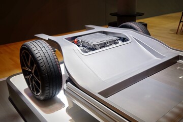 Detailed view of an electric vehicle (EV) skateboard chassis platform showing the battery integration and powertrain architecture. © Yesh
