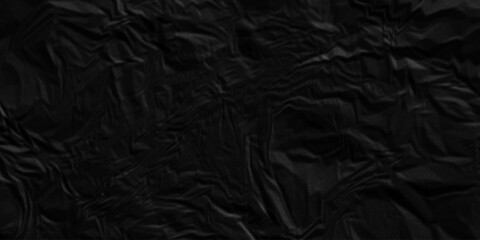 Fototapeta premium Dark black crumpled paper texture background. black crumpled and top view textures can be used for background of text or any contents.