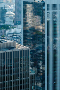 Corporate Frankfurt Bankenviertel skyline with modern glass tower reflections and dense urban architecture rising in the financial district core