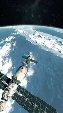 Vertical 3D animation of a space station in Earth orbit with a docked commercial spacecraft.