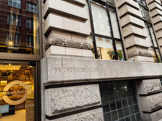 Fototapeta premium Bridgewater House exterior in Manchester UK showing stone facade and glass windows at street level
