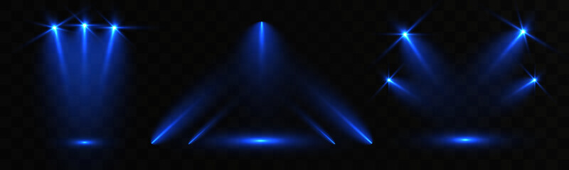 Blue stage spotlights with glowing beams and lens flares on dark opaque background, concert lighting abstract effect.