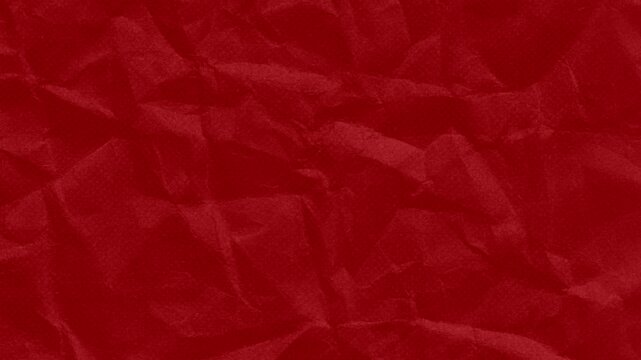 The red paper background is crumpled, the surface is old and creased.