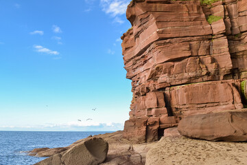 Red sandstone cliffs at Fleswick Bay, St Bees Head, Cumbria, England © Aneta