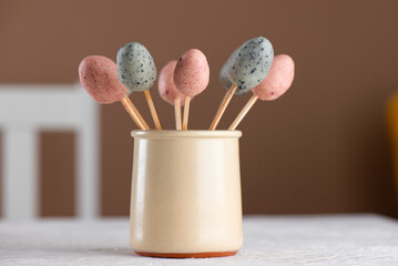 Homemade sweet marzipan Easter eggs on a table. Vegan candy. Sugar, gluten and lactose free.