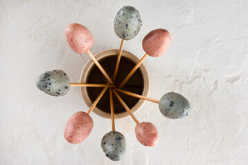 Marzipan Easter eggs on a sticks. Vegan candy. Sugar, gluten and lactose free. Top view.