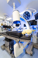 Modern hybrid operating room with robotic imaging technology. View of advanced medical equipment...