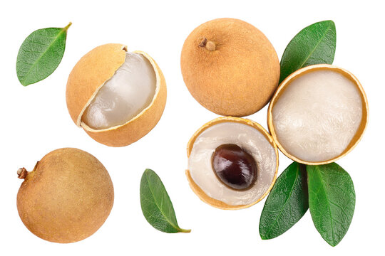 Fresh longan fruit with leaves isolated on white background. Top view. Flat lay