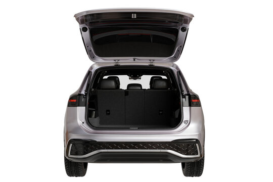 Rear view of a modern silver SUV with its tailgate open, revealing an empty, dark cargo space and folded rear seats. Isolated on a transparent background