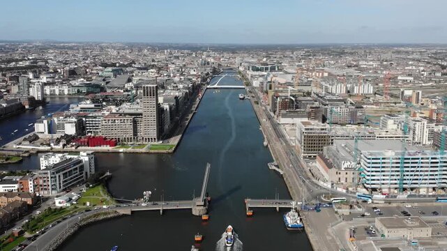 Tom Clarke Toll Bridge is open for incoming ship by Dublin Port, Ireland. Drone view, transportation
