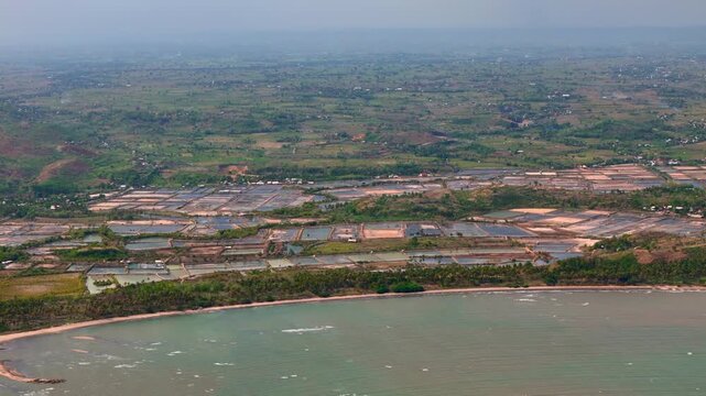 Salt ponds near coastline coastal landscape with shallow water fields and sea horizon Coastal landscape with ponds