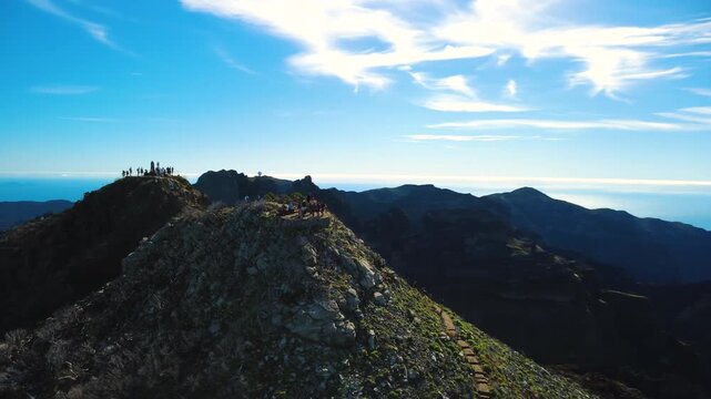 4K Drone Offset Orbit of Pico Ruivo Summit, Madeira: People at Observation Deck, Geodesic Marker Above Hikers, Pico do Areeiro Observatory on Horizon, Symbolic Mountain Peak, Cinematic Shot