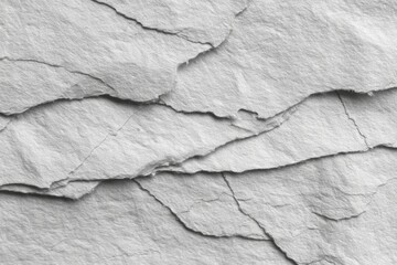 Layered natural stone surface exhibits rough texture and overlapping stratification