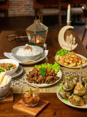 Traditional Ramadan Iftar Table with Arabic Dishes and Lantern Decor