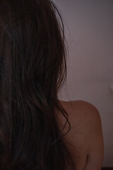 Back view of woman after spa and wellness treatment