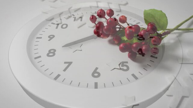 White clock bearing red berries while ghost overlay appearing hands sweeping clockwise showing time