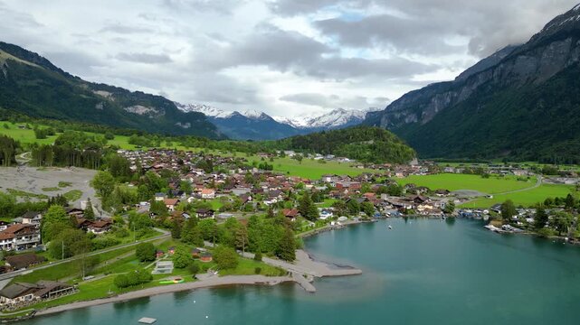 Brienz Switzerland Alpine Town with Turquoise Lake and Snow-Capped Mountains