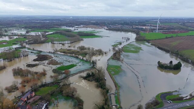 Aerial drone view of extensive flooding in the Soar Valley Leicestershire with river banks breached and vast farmland submerged after heavy rain.