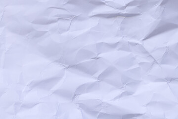 Obraz premium Crumpled White Paper Texture Background,Macro,Close-up top view of a heavily crumpled and wrinkled white paper sheet texture. This abstract background features various folds, creases, and shadows, 