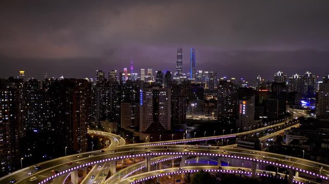 Chicago Skyline at Night with Illuminated Highway Interchange