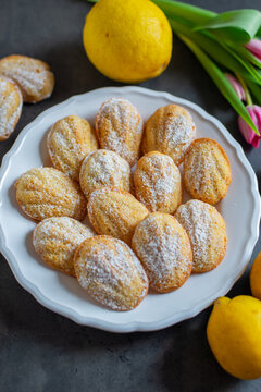 Freshly baked french madeleines with lemon