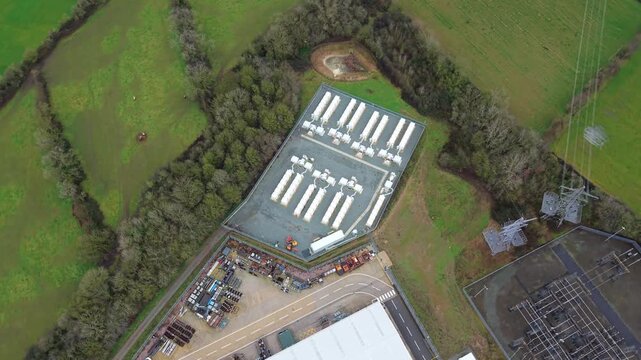 Close Drone View Of Containerized Energy Storage Modules Designed For Grid Overload Mitigation At Enderby UK