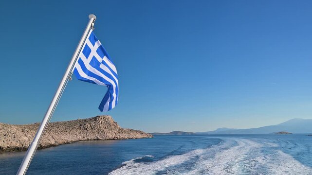 Greek Flag on Ferry Leaving Chalki Island, Greece