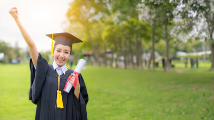 Graduateก woman students wearing graduation hat and gown, congratulations for end of study