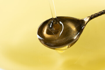 Refined Sunflower Oil Pouring into Spoon, Frozen Motion Macro
