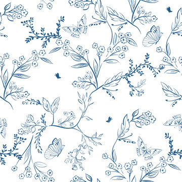 Seamless blue and white floral pattern with butterflies. Hand drawn vintage toile sketch background. Porcelain botanical textile design.
