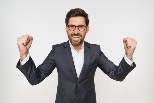 Excited businessman, portrait and celebration in studio for achievement, success in career. Trader, professional and promotion in corporate company for goals, development and exited for increase