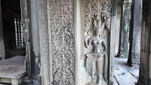 intricately carved apsara sculpture on temple wall at angkor wat cambodia