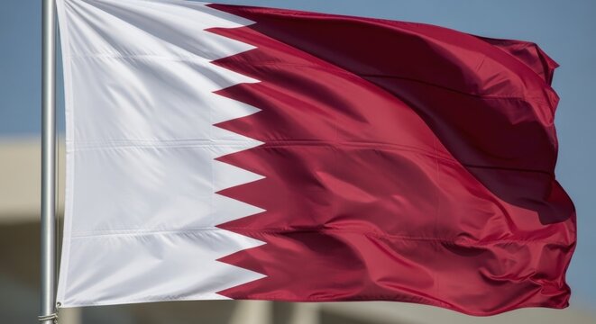 Qatar Flag Waving Under Clear Sky