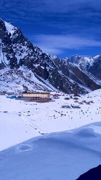 Portillo Ski Station At Andes Mountains Valparaiso Chile. Ski Lift Passing Over Frozen Mountain In Winter Landscape. Snowy Countryside Andes Mountains Map Blizzard. Snowy Nature.