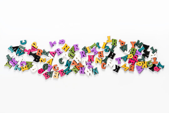 Colored letters of the English alphabet on white background are located in the center.